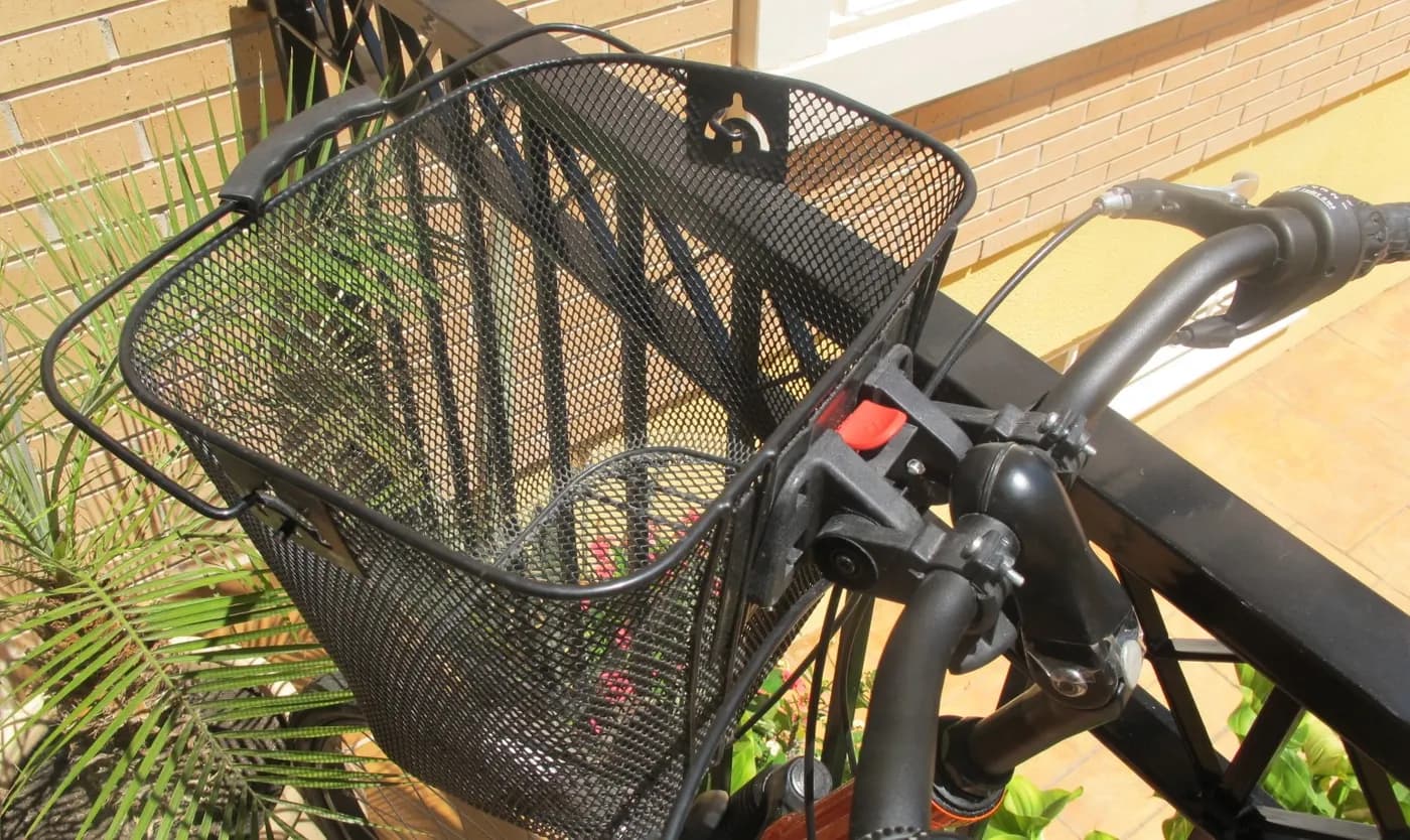 A front basket on a two-wheel bicycle.