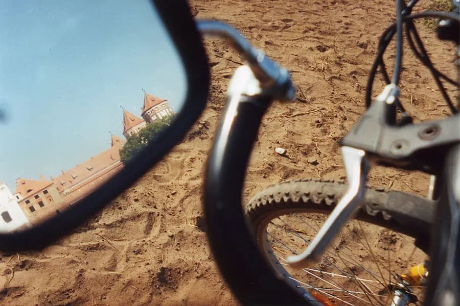 Landscape reflected in a bicycle rearview mirror