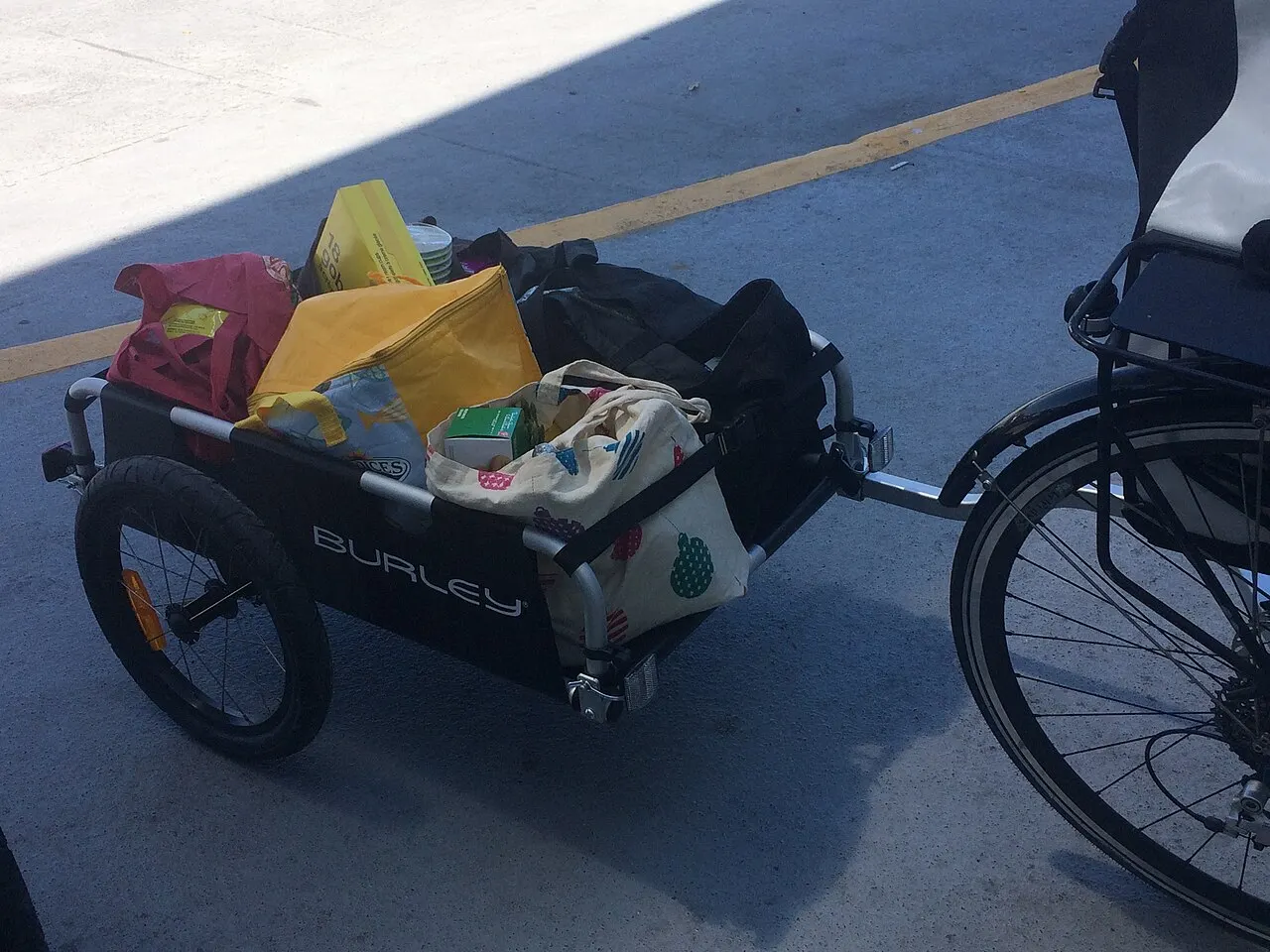 Loaded cargo trailer attached to a bicycle