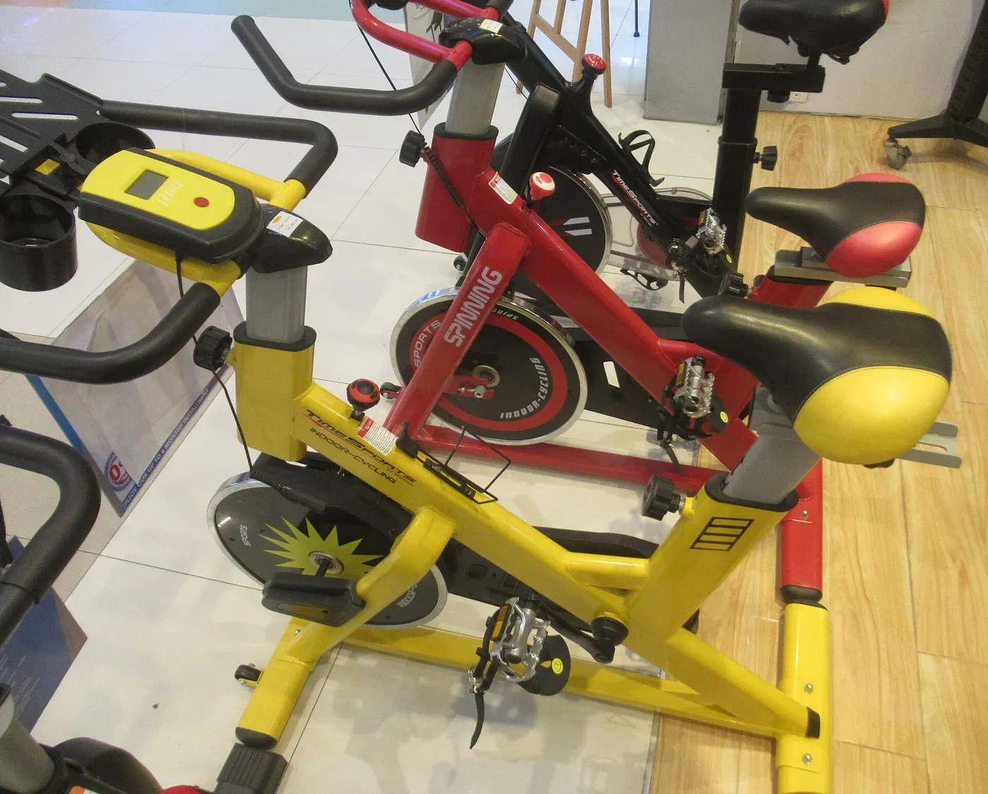 Several indoor exercise bicycles with resistance controls.