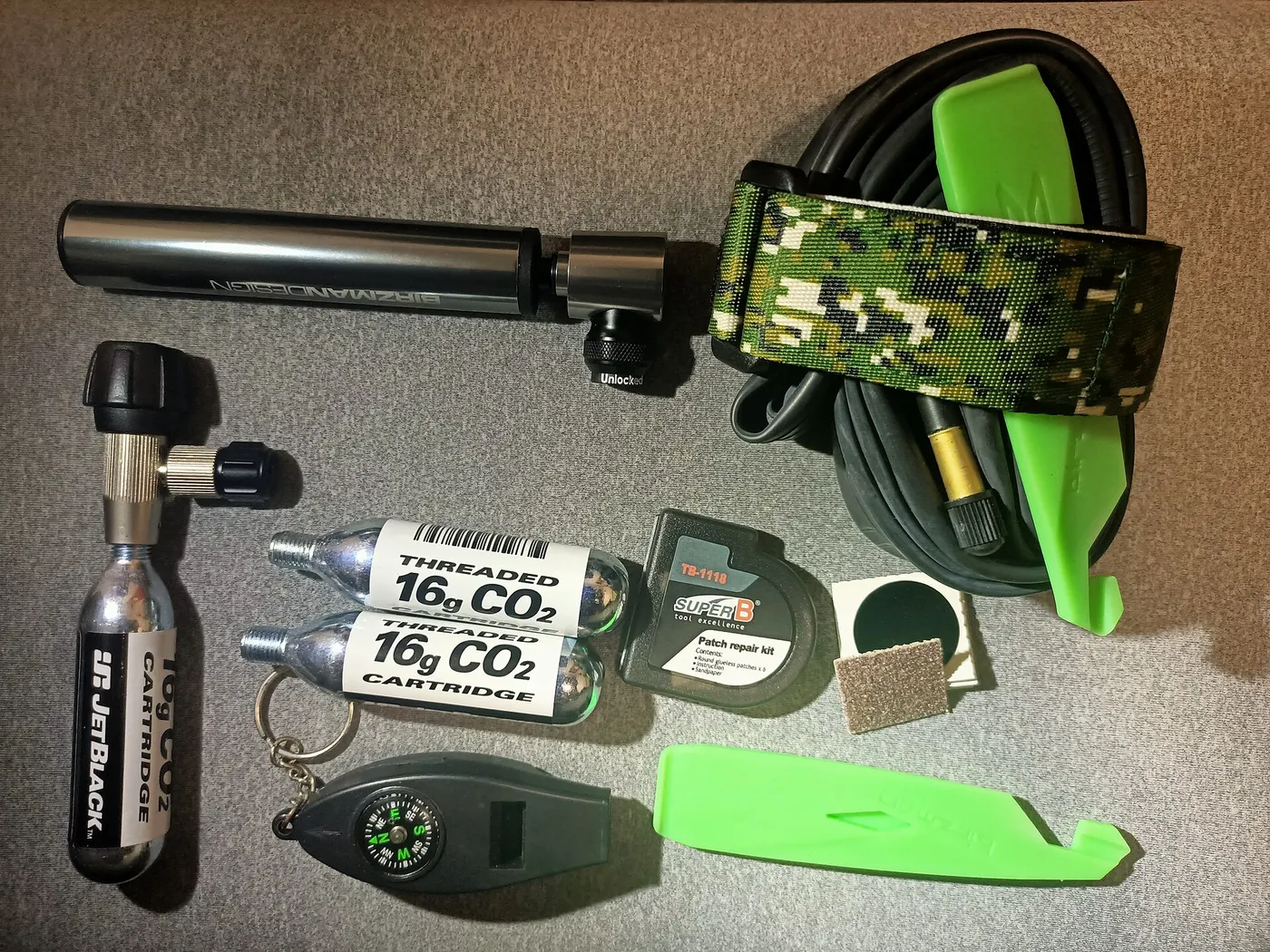 A compact emergency kit containing a tube, inflation equipment, and tire tools.